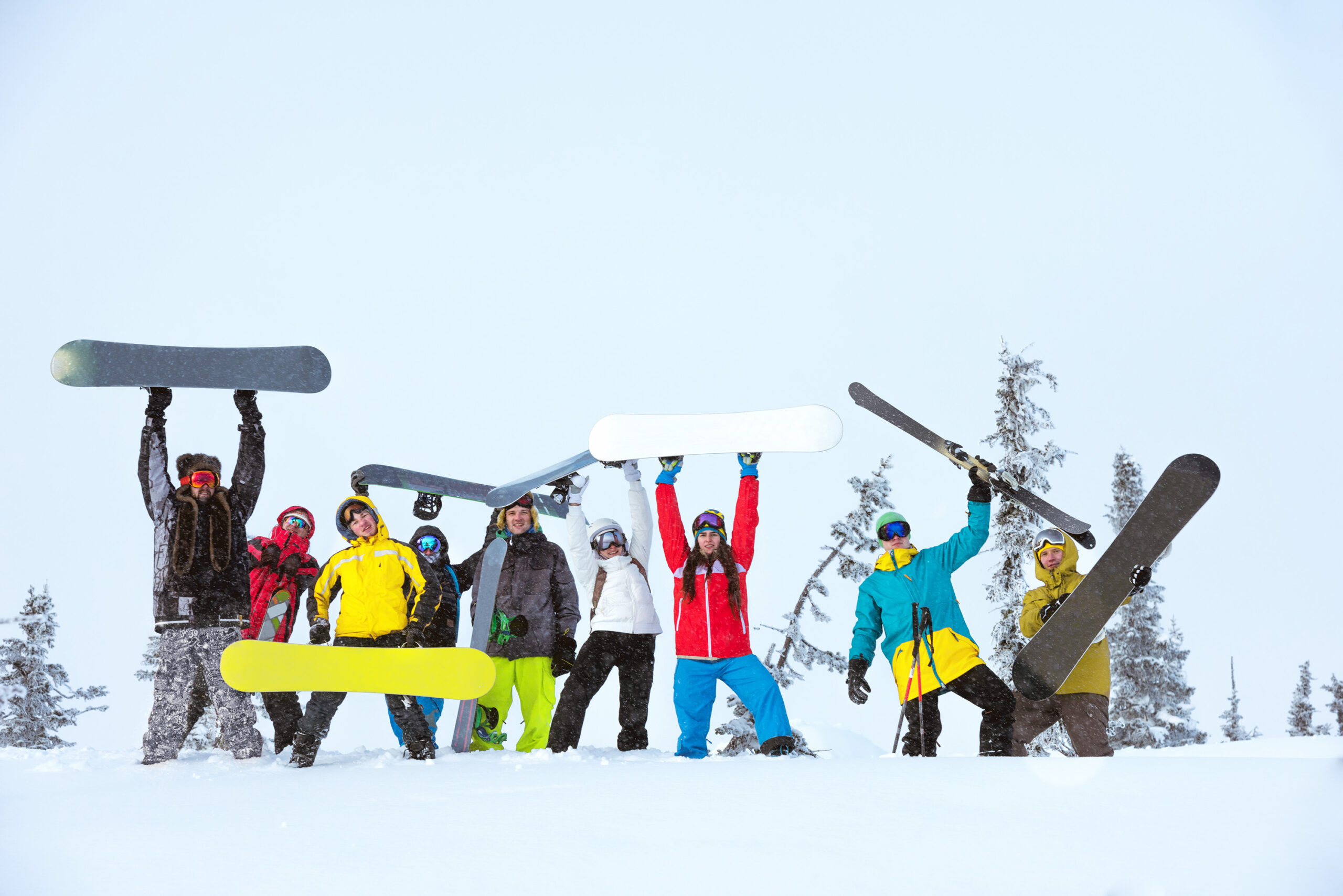 friends team group skiers snowboarders